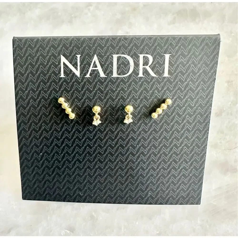 Gold set of two petite Nadri stud earrings ￼
